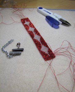 Bracelet which has threads still hanging out All these threads have to be woven back into the beads - copyright Helen White 2011
