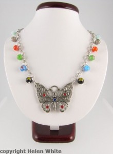 Necklace with butterfly pendant and millefiori beads - copyright Helen White