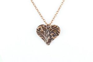 Floral heart copper pendant